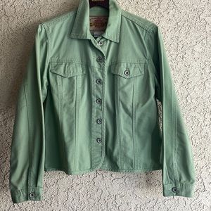 Denim Jean jacket with metal buttons in front and pockets.